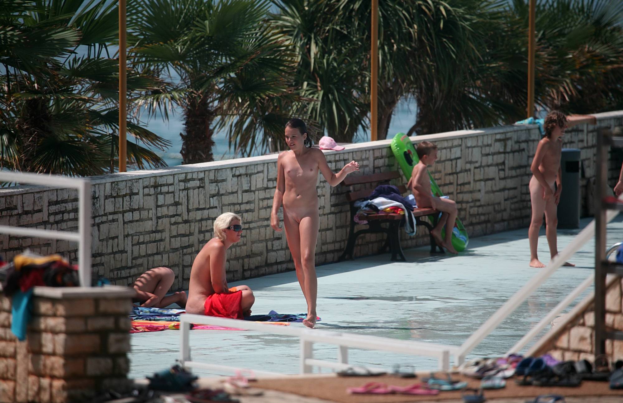 Pure Nudism Photos From the Pool to Walkway - 1
