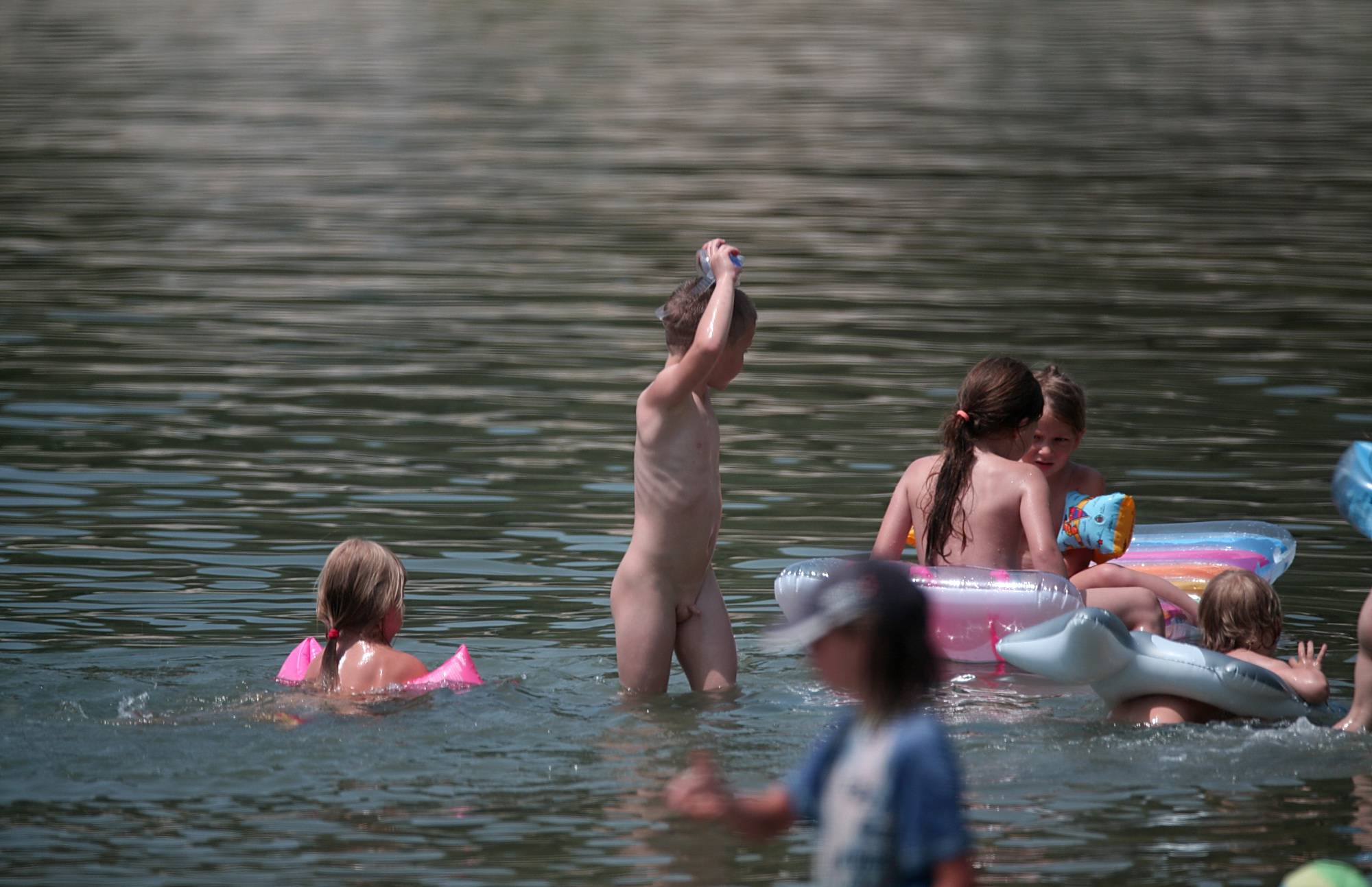 Relax Aboard A Floaty Raft Nudist Girls - 1