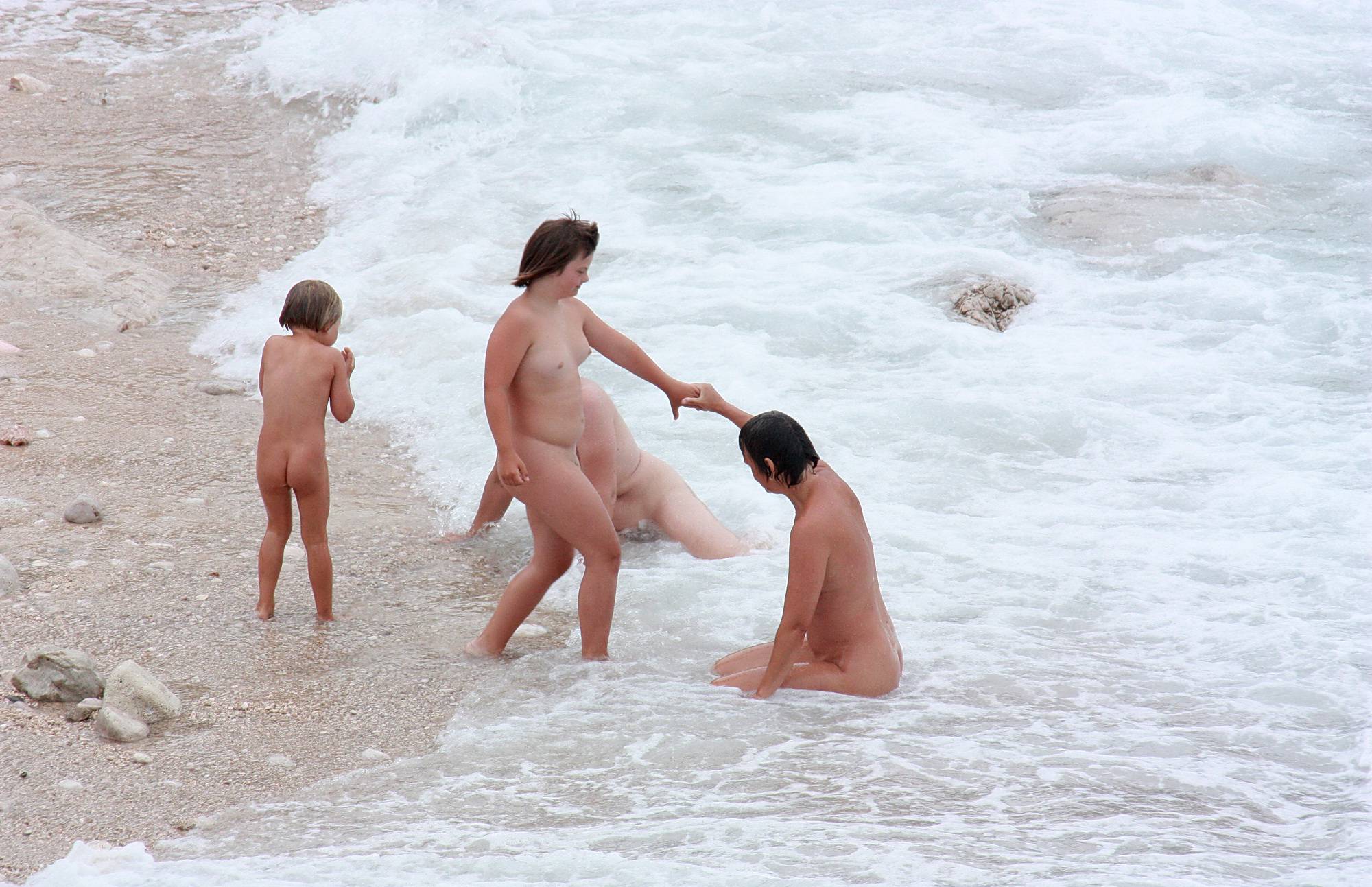 Pure Nudism Wading In Coastal Waves - 2